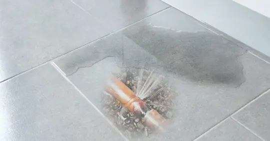 Wet floor due to underground pipe leak